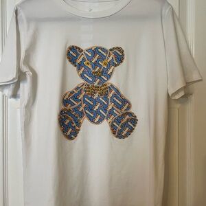 White T-Shirt with Blue Bear Design.